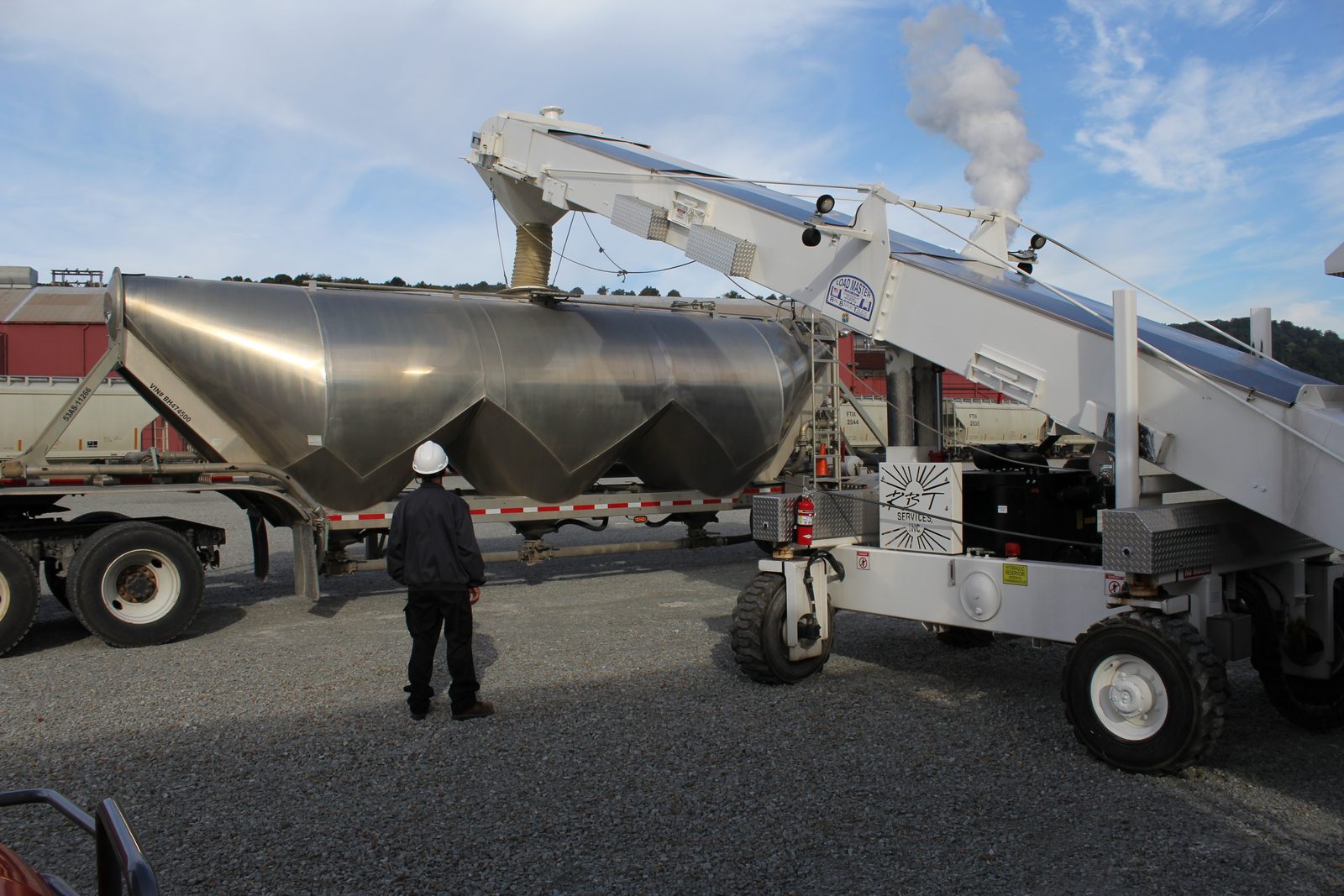 Operator overseeing a bulk transfer at a transload terminal